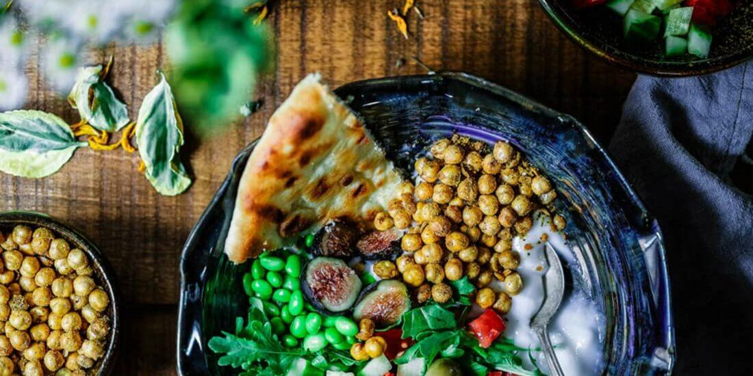 A plate of food on top of a wooden table.