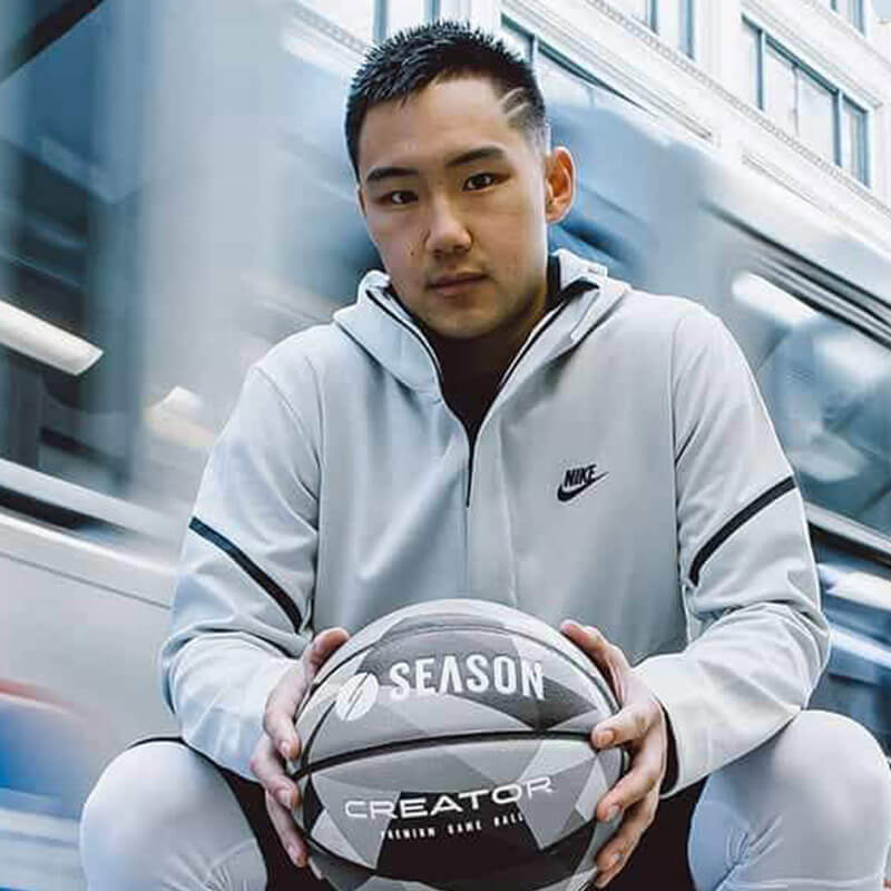 A man holding a basketball in his hands.