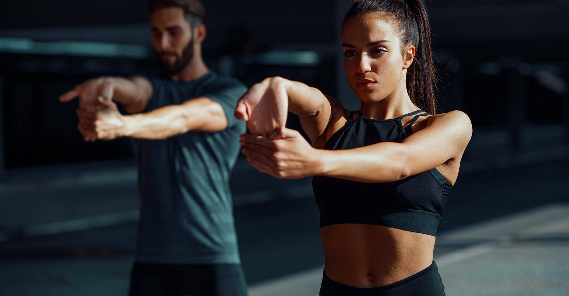 A man and woman are doing exercises together.