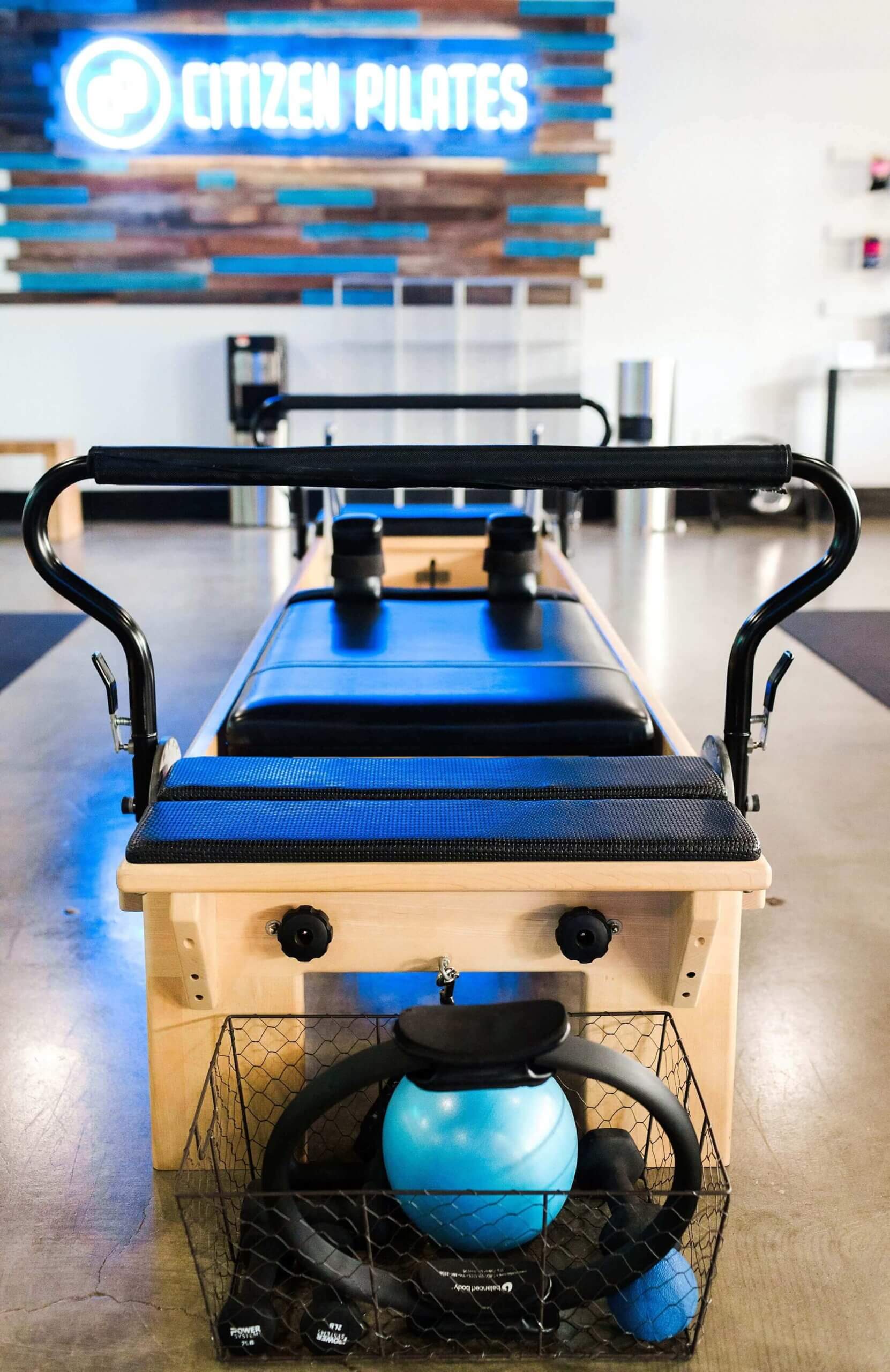 A pilates machine in the middle of a room.