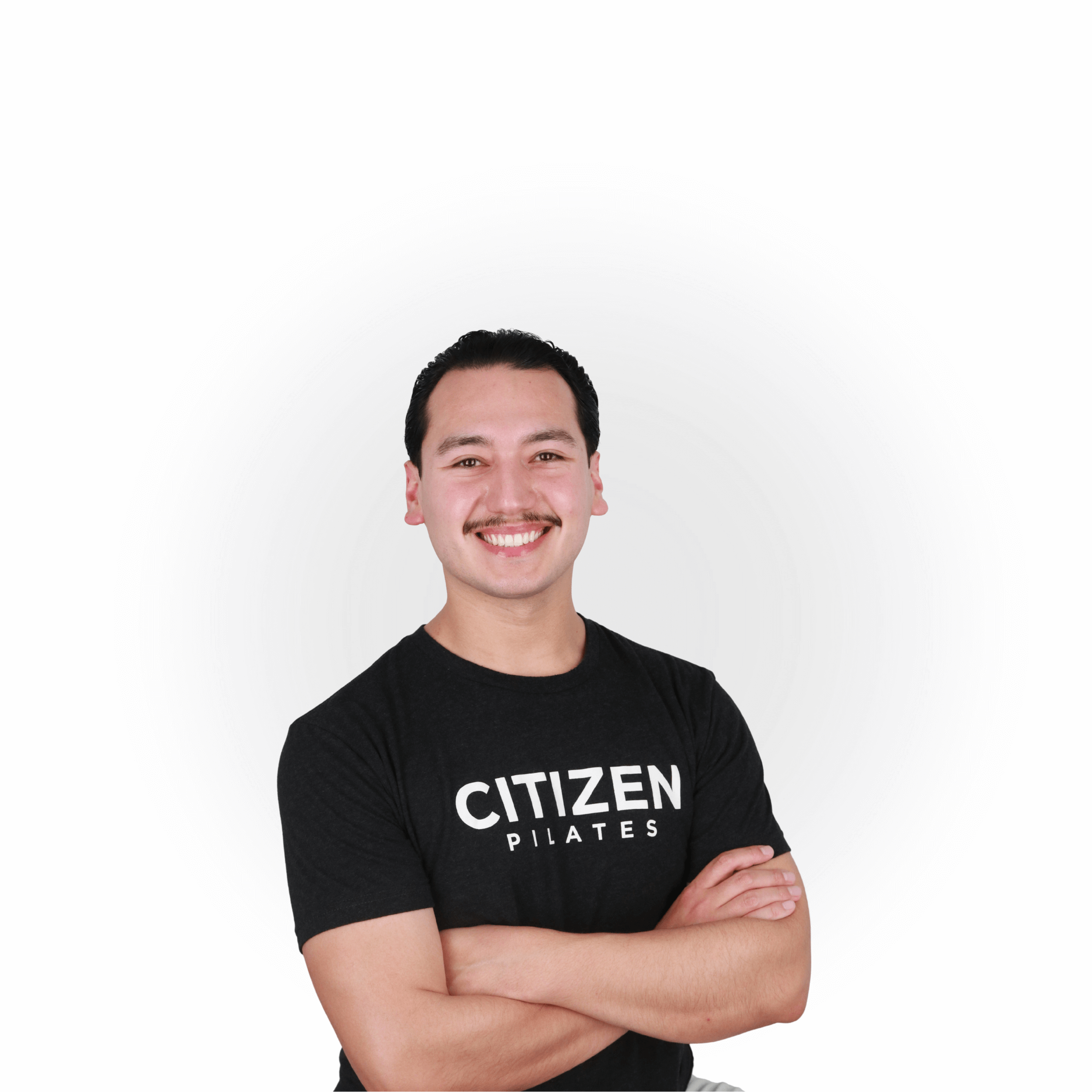 Joey, senior Pilates instructor at Citizen Pilates, smiling during a professional headshot