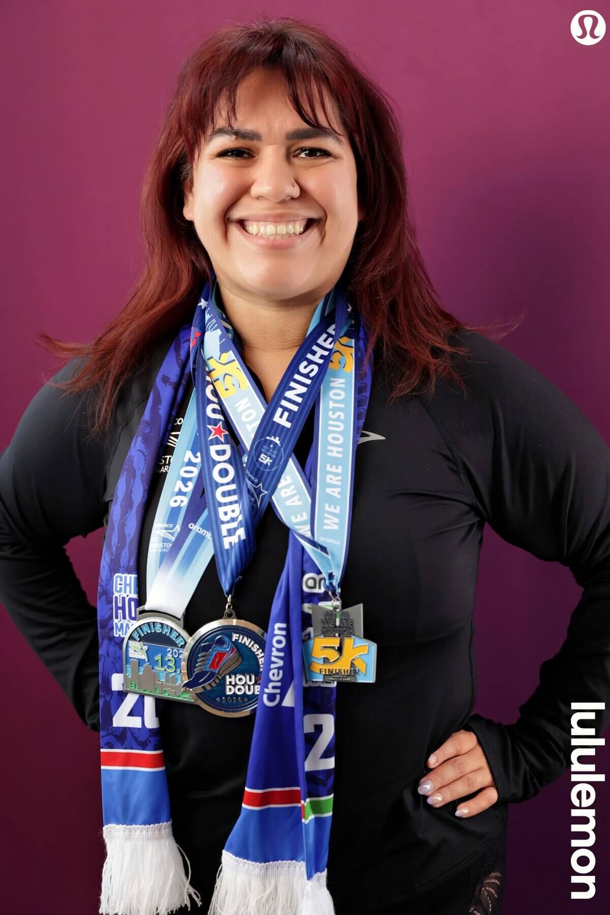 Leslie Gonzalez smiling after completing her first half marathon, a Citizen Pilates Spring Branch client celebrating strength, consistency, and 61 Pilates classes