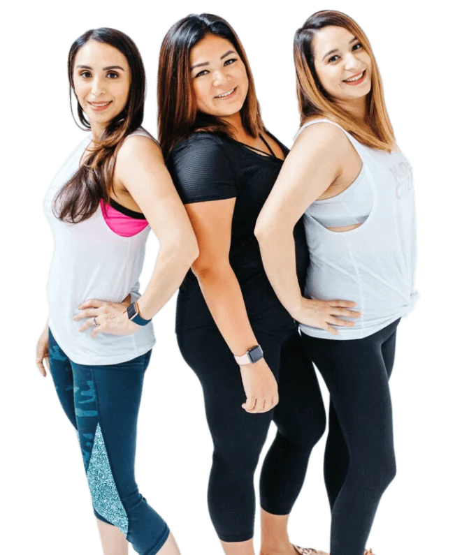 Three women posing for a picture in their gym clothes.